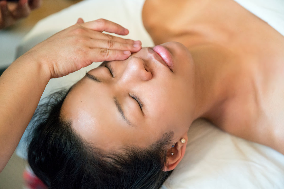 Aesthetician preparing a treatment room and equipment for a med spa client