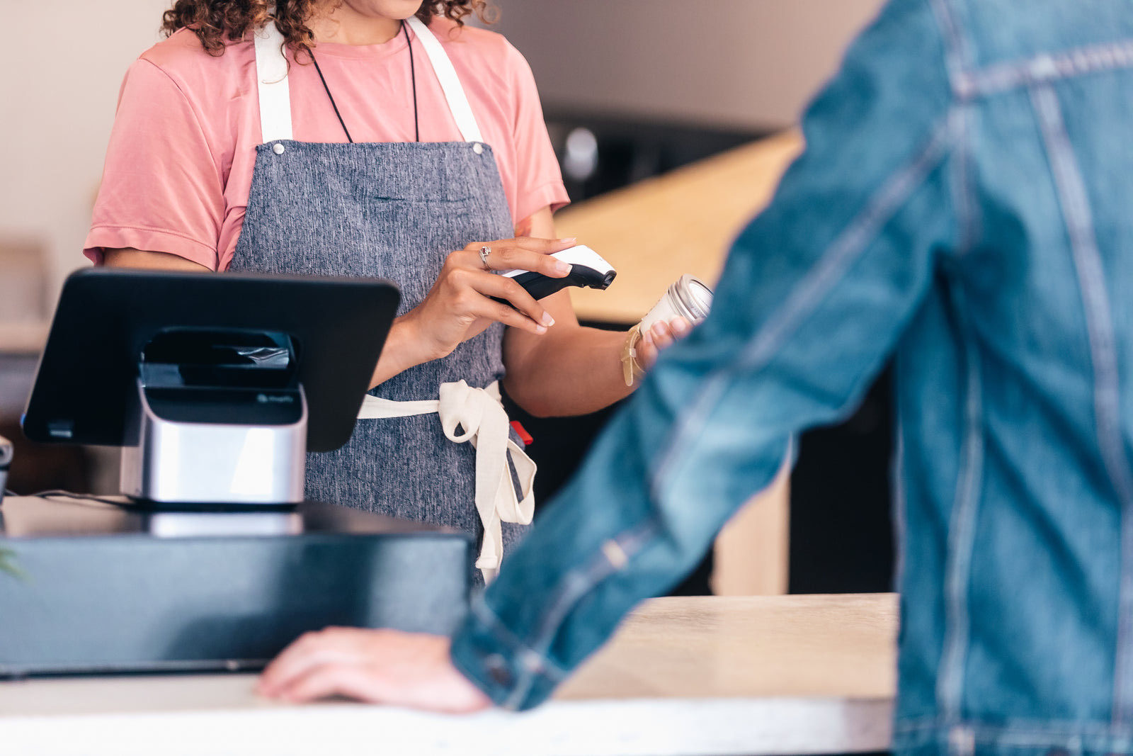Shoppers waiting in line at a store checkout counter in the United States