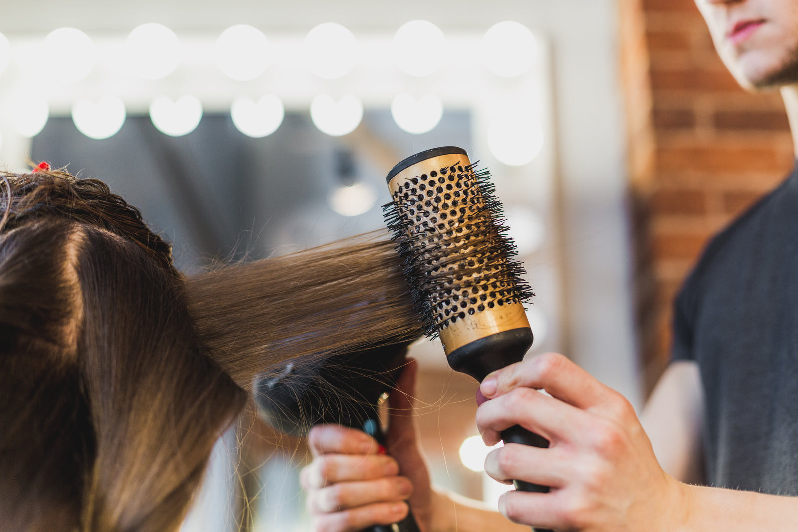 Busy hair salon full of clients and stylists working during peak hours