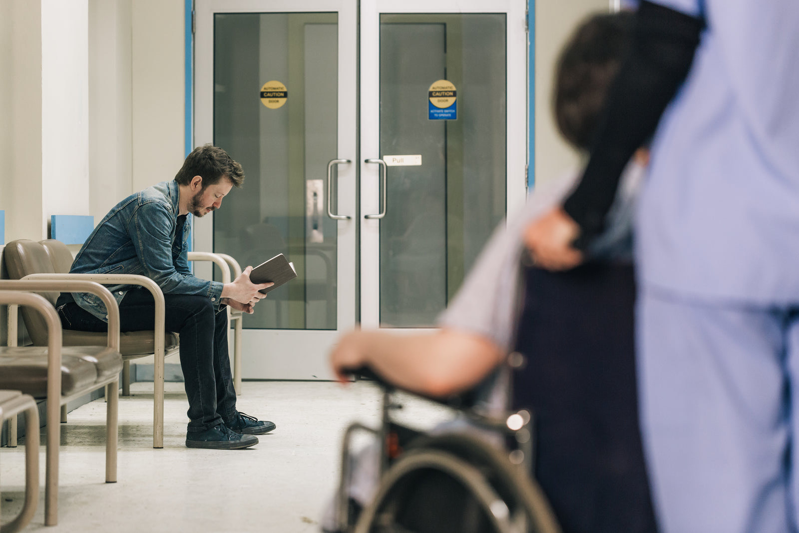 Patients waiting in the OPD registration hall of a large government hospital in India