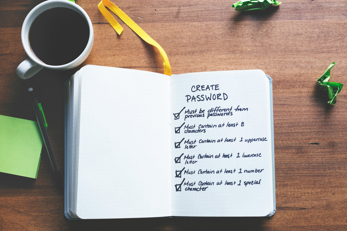 A printed checklist on a clipboard being reviewed with a pen during business planning